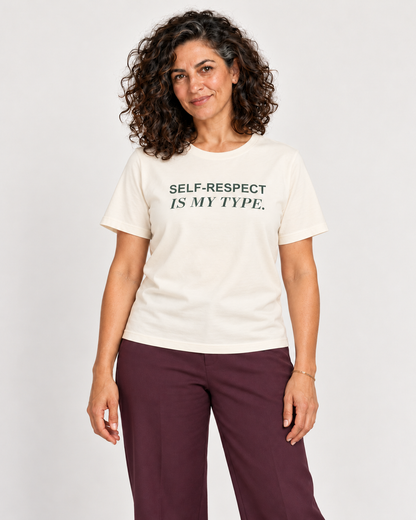 Leila wearing the Natural SELF-RESPECT IS MY TYPE. Bella+Canvas 3001 tee in a natural studio portrait