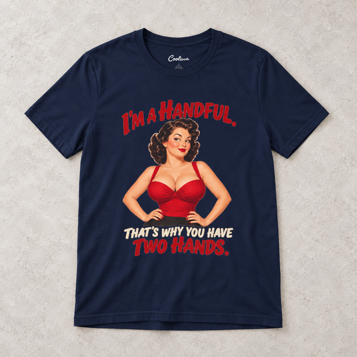 Navy Cooliooli T-shirt with the “I’m a handful. That’s why you have two hands.” pin-up design, front flat lay