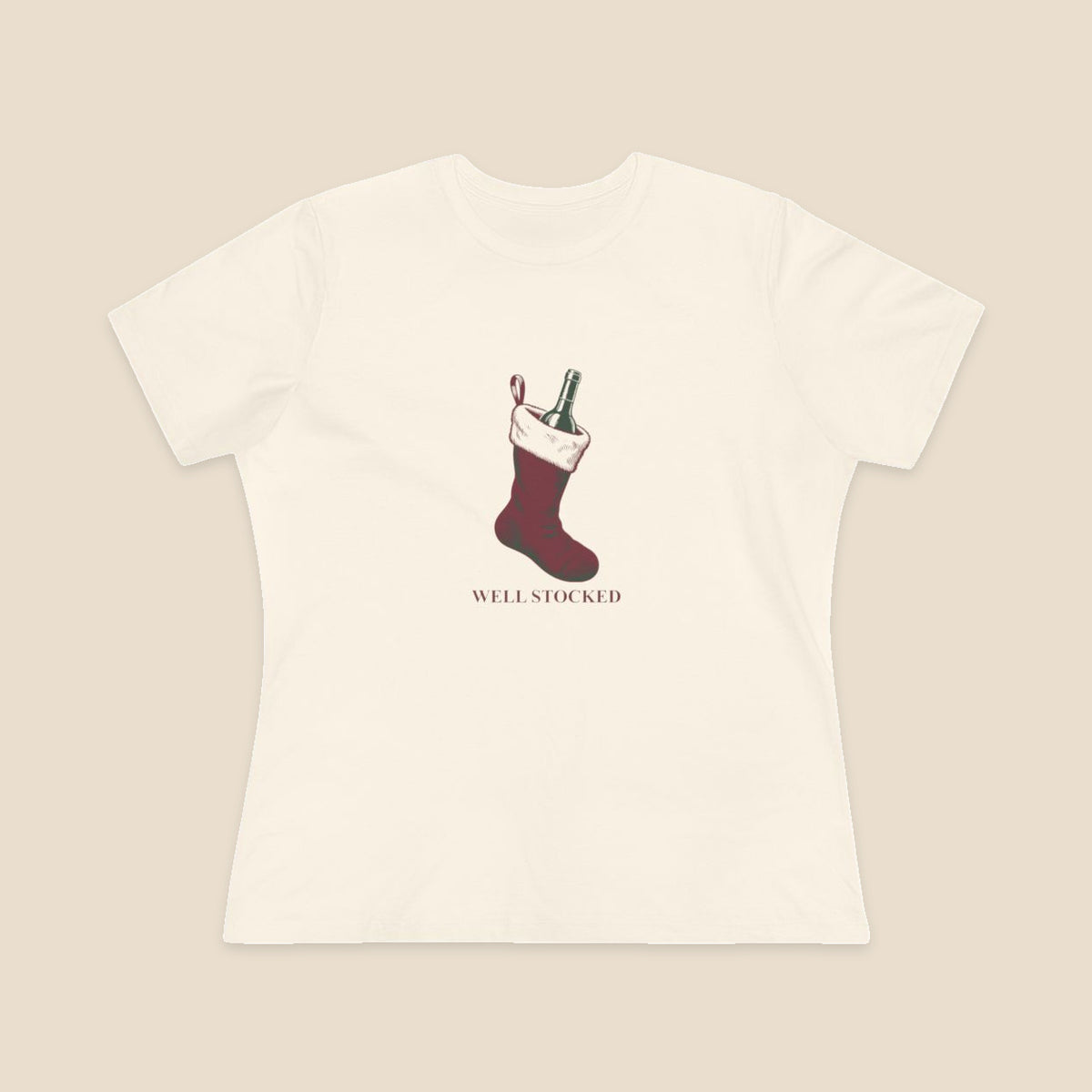 Well Stocked wine-stocking Christmas graphic on a Natural Bella+Canvas 6400 women’s relaxed-fit tee; front colour preview.