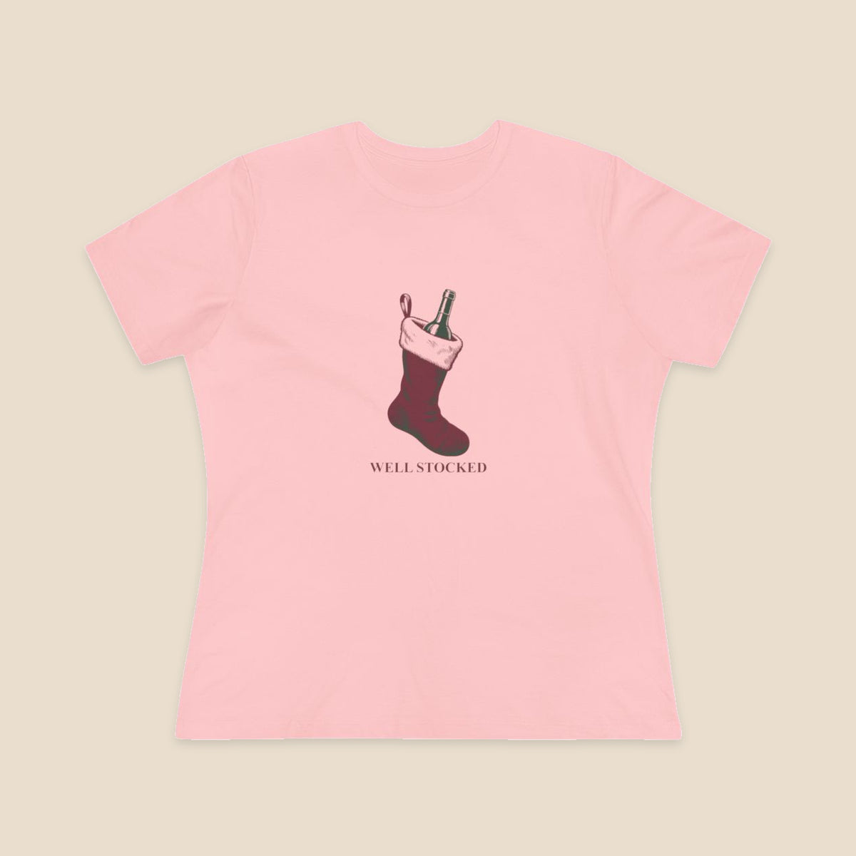 Well Stocked wine-stocking Christmas graphic on a Pink Bella+Canvas 6400 women’s relaxed-fit tee; front colour preview.
