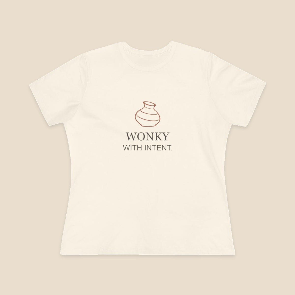 Wonky With Intent pottery graphic on a Natural Bella+Canvas 6400 women’s relaxed-fit tee; front colour preview.